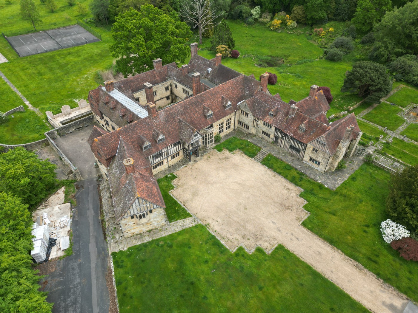 A manor house and courtyard from above